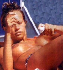 3. Anna Falchi – Topless sunbathing
