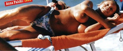 5. Anna Falchi – Topless sunbathing