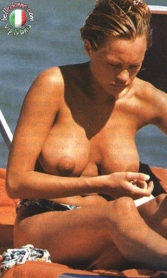 10. Anna Falchi – Topless sunbathing