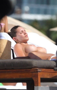 6. Carla Velli – Topless sunbathing, 2009