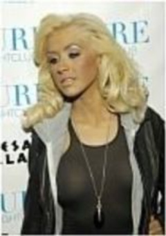 2. Christina Aguilera – Skin tight grey dress