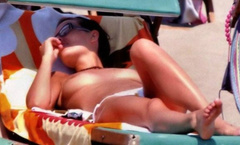 1. Claudia Pandolfi – Topless sunbathing, 2006