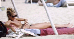 9. Elle Macpherson – Topless sunbathing, 1995