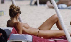 10. Elle Macpherson – Topless sunbathing, 1995