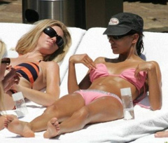 3. Eva Longoria – Sunbathing by the pool, 2005