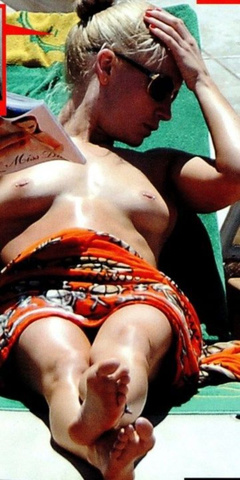 1. Holly Weston – topless sunbathing, 2013