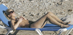 4. Kate Lawler – Topless sunbathing, 2006