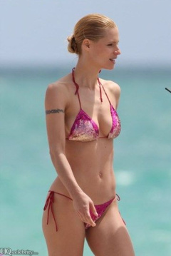 16. Michelle Hunziker – red bikini, 2010
