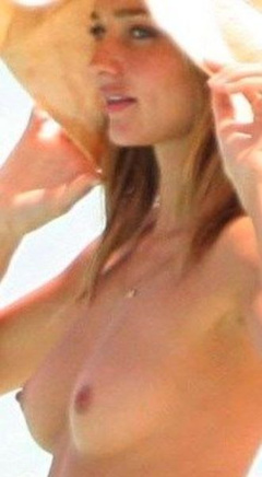 6. Miranda Kerr – topless at the beach, 2009