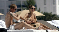 19. Oksana Andersson – Topless sunbathing, 2008