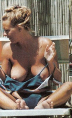 1. Paola Perego – Topless sunbathing, 2001