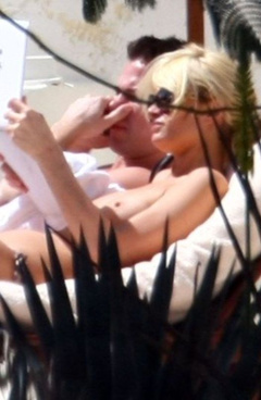 2. Paris Hilton – Topless sunbathing, 2010