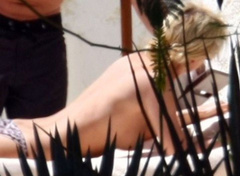 3. Paris Hilton – Topless sunbathing, 2010