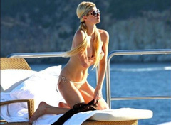 7. Paris Hilton – Topless sunbathing, 2010