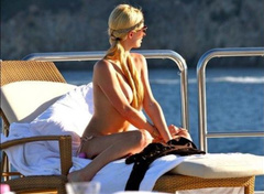8. Paris Hilton – Topless sunbathing, 2010
