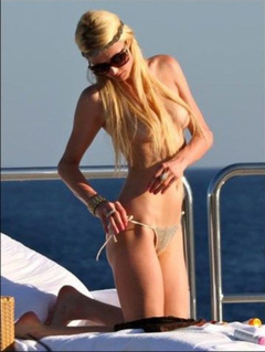 16. Paris Hilton – Topless sunbathing, 2010