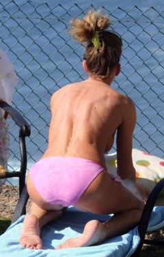 3. Paula Hamilton – Topless sunbathing, 2013