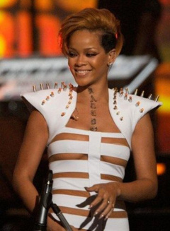 4. Rihanna – Stripes suit in Concert, 2009