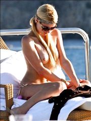 Paris Hilton – Topless sunbathing, 2010