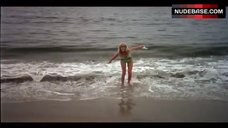 3. Louise Golding Flashes Boobs on Beach – Lifeguard