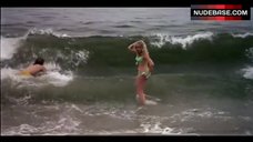 5. Louise Golding Flashes Boobs on Beach – Lifeguard