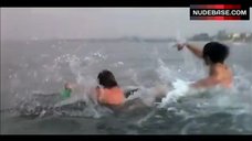 9. Louise Golding Flashes Boobs on Beach – Lifeguard