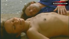 10. Christine Boisson Topless Sunbathing – La Mecanique Des Femmes