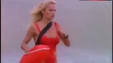 4. Pamela Anderson Rans in Swimsuit – Baywatch