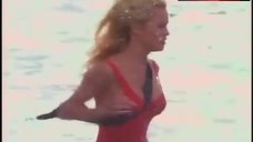 8. Pamela Anderson Rans in Swimsuit – Baywatch