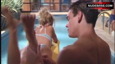 7. Pamela Anderson in Bikini near Pool – V.I.P.