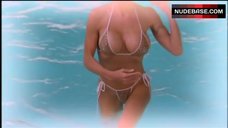 Pamela Anderson Floats in Mini-Bikini – V.I.P.