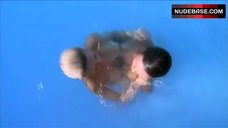8. Sabrina Machado Swims in Pool Topless – Never Surrender