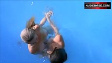 9. Sabrina Machado Swims in Pool Topless – Never Surrender