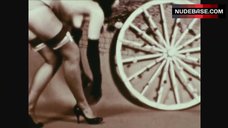 1. Bettie Page Posing Naked with Wheel – The Exotic Dances Of Bettie Page