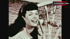 10. Bettie Page Posing Naked with Wheel – The Exotic Dances Of Bettie Page