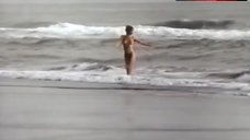 9. Rosanna Arquette Topless on Beach – The Wrong Man