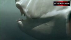 7. Amber English Topless on Beach – 2-Headed Shark Attack