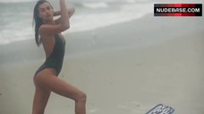 7. Irina Shayk Sexy in Black Swimsuit – Love Advent Calendar Shoot