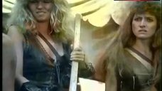 7. Lana Clarkson Topless Fight in Mud – Barbarian Queen Ii