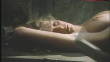 1. Lana Clarkson Lying Topless on Table – Barbarian Queen Ii