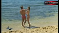 3. Agnes Soral Topless on Beach – Un Moment D'Egarement