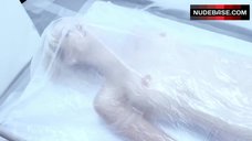 100. Lauren Lakis Laying Nude on Table – Gun Woman