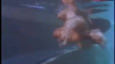 5. Michelle Bauer Swims Topless in Pool – Bikini Drive-In