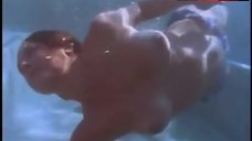 Michelle Bauer Swims Topless in Pool – Bikini Drive-In