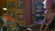 6. Carole Bouquet Sexy in Black Corset – A Business Affair