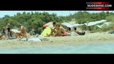 10. Elli Tringou Topless on Beach – Suntan