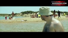 8. Elli Tringou Topless on Beach – Suntan