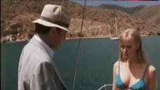 1. Laura Harris in Sexy Blue Bikini Scene – Suicide Kings