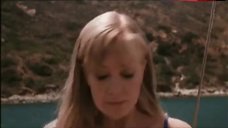 10. Laura Harris in Sexy Blue Bikini Scene – Suicide Kings