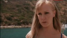 3. Laura Harris in Sexy Blue Bikini Scene – Suicide Kings